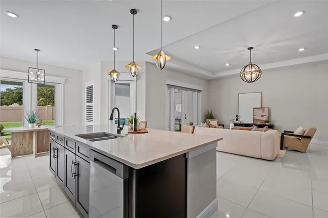 a kitchen with sink cabinets and couches