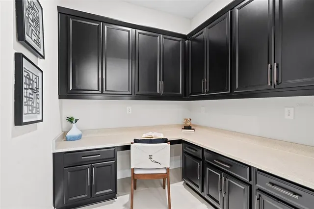 a kitchen with a sink cabinets and appliances