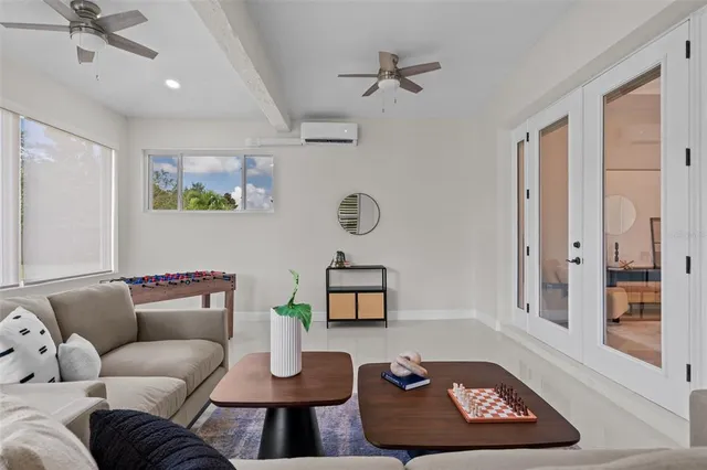 a living room with furniture and a rug