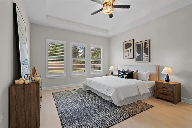 a bedroom with a large bed and a window