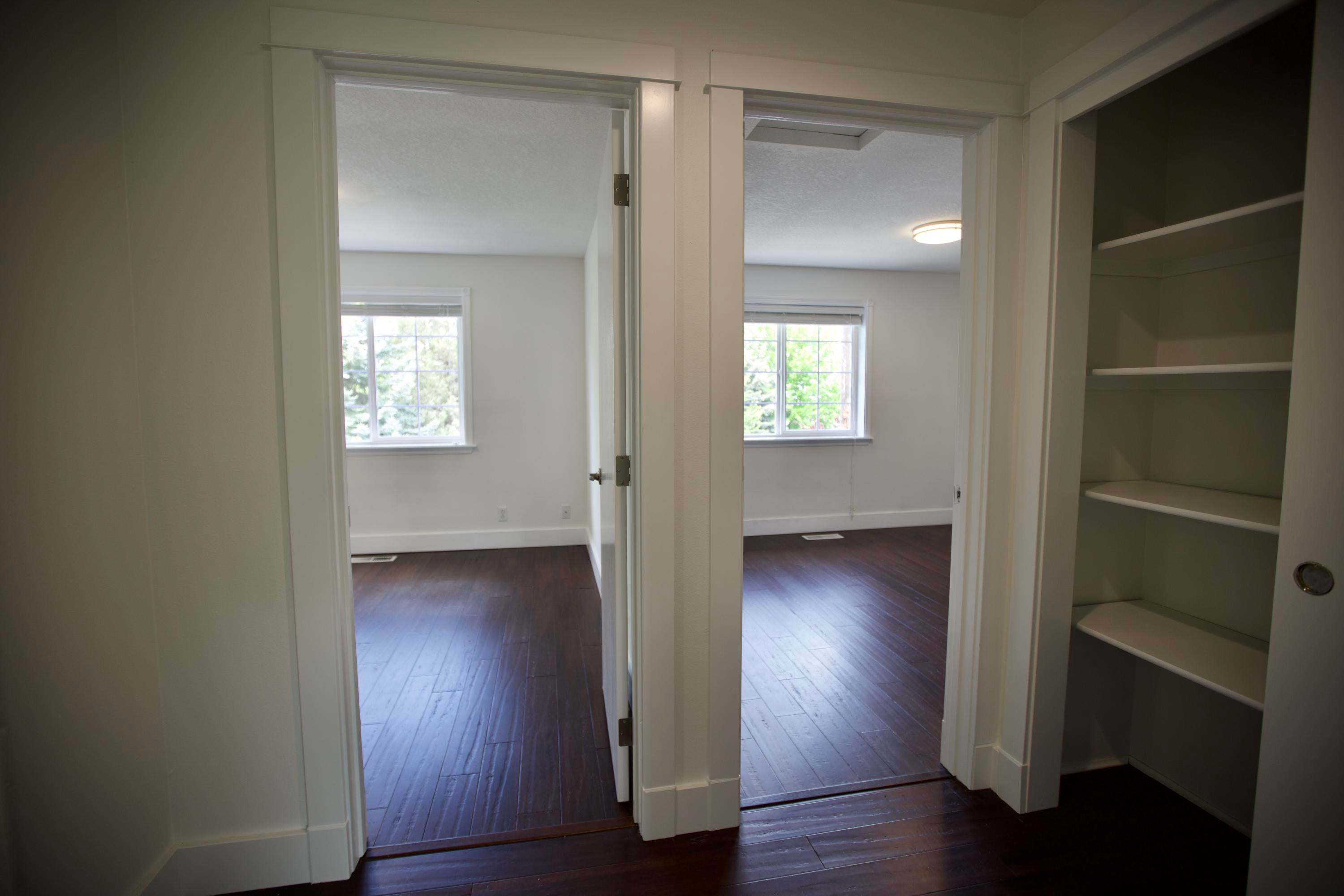 3608 Southwest Volcano Court Redmond, OR 97756 - Photo 18 of 47 bedrooms 2 and 3 side by side at end of hall facing north, main bedroom directly across with a linin closet between.