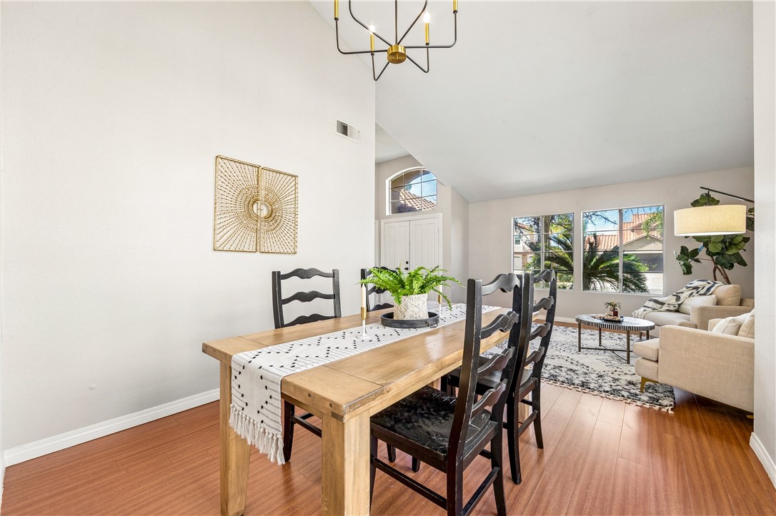 9146 Rangpur Circle Riverside, CA 92508 - Photo 15 of 52 a view of a dining room with furniture and wooden floor