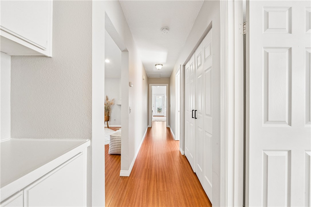 9146 Rangpur Circle Riverside, CA 92508 - Photo 28 of 52 a view of a hallway with wooden floor and staircase