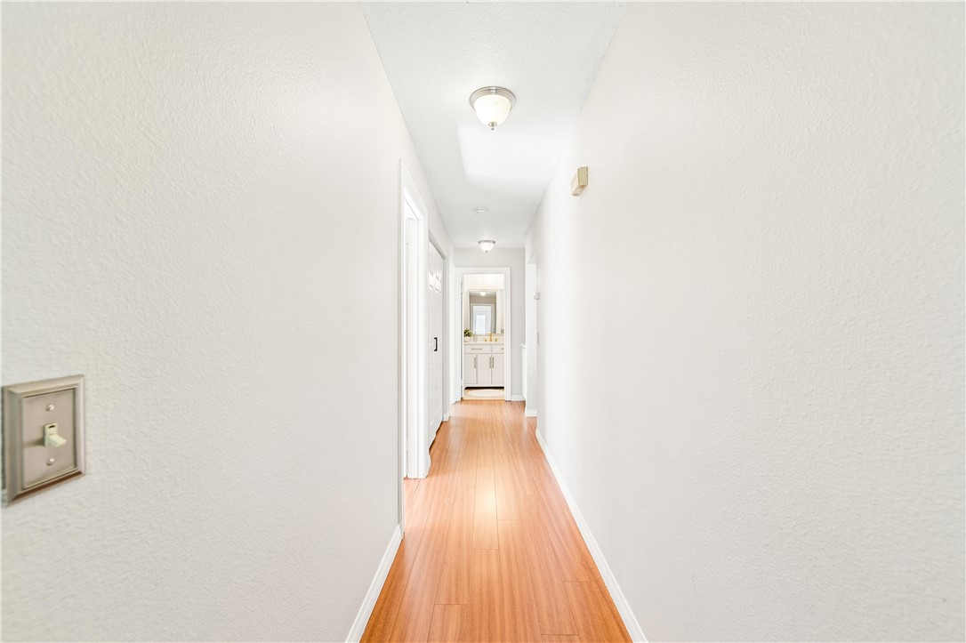 9146 Rangpur Circle Riverside, CA 92508 - Photo 30 of 52 a view of a hallway with wooden floor