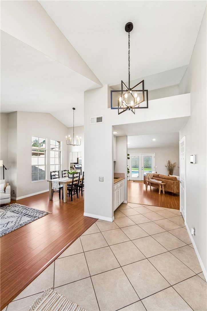 9146 Rangpur Circle Riverside, CA 92508 - Photo 3 of 52 The entry opens to a spacious family room with a wet bar, fireplace, and wall-to-wall windows that fill the space with natural light.