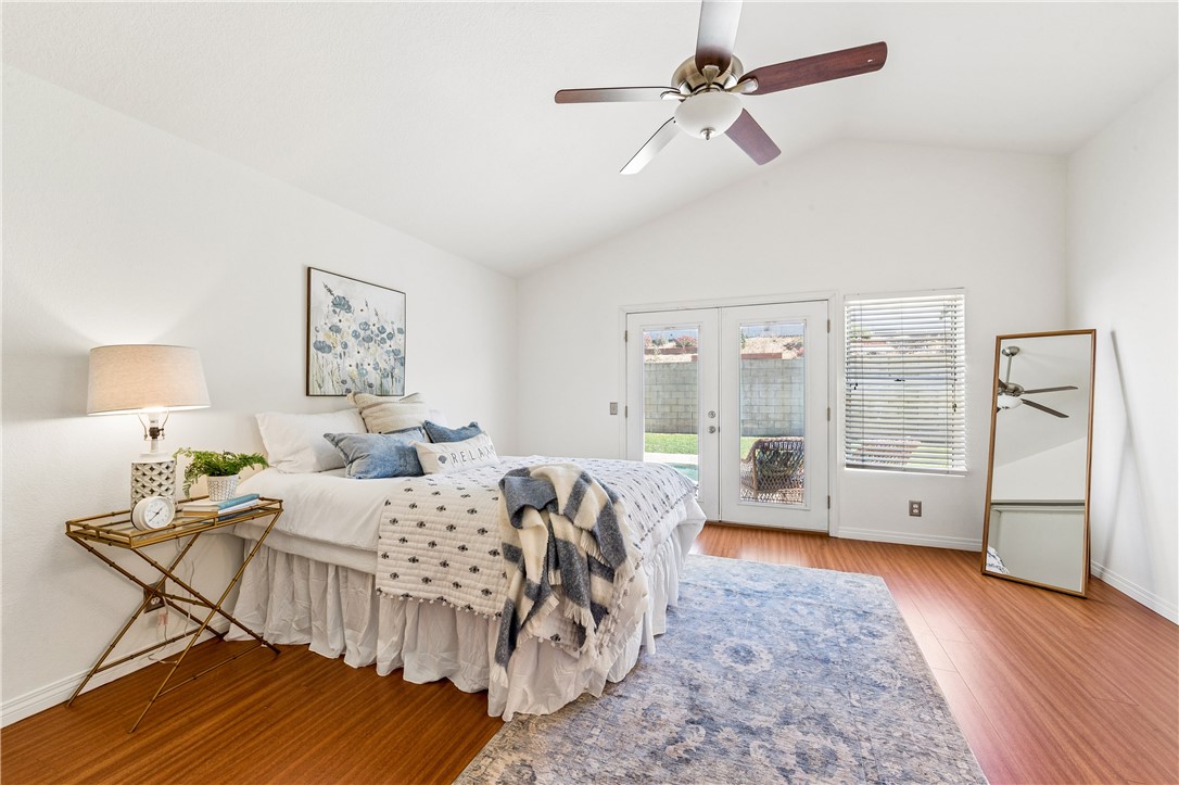 9146 Rangpur Circle Riverside, CA 92508 - Photo 31 of 52 a bed room with a bed and a chandelier