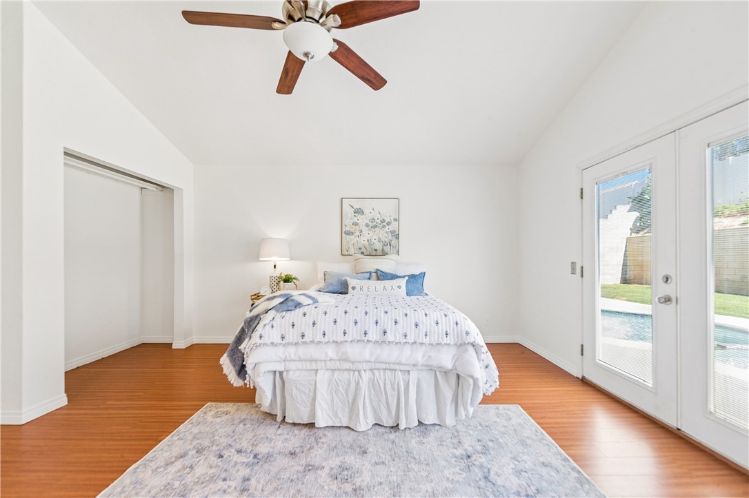 9146 Rangpur Circle Riverside, CA 92508 - Photo 35 of 52 a bedroom with a bed and wooden floor