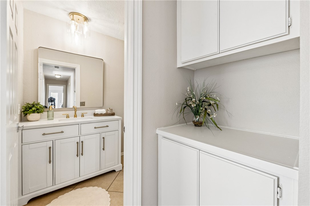 9146 Rangpur Circle Riverside, CA 92508 - Photo 42 of 52 a bathroom with a sink and a mirror