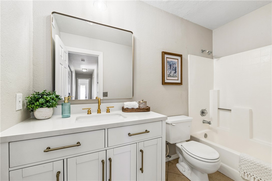 9146 Rangpur Circle Riverside, CA 92508 - Photo 43 of 52 a bathroom with a toilet a sink and mirror