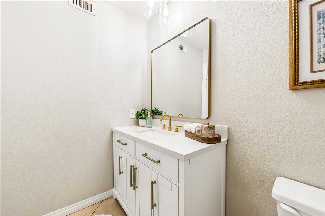 9146 Rangpur Circle Riverside, CA 92508 - Photo 44 of 52 a bathroom with a sink and a mirror
