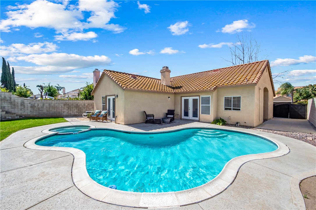 9146 Rangpur Circle Riverside, CA 92508 - Photo 47 of 52 a view of a house with swimming pool and porch