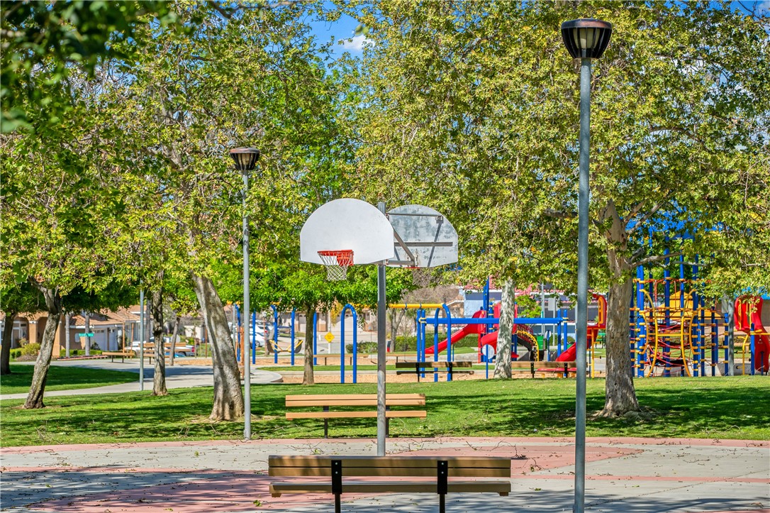 9146 Rangpur Circle Riverside, CA 92508 - Photo 52 of 52 a view of a house with a backyard and a tree