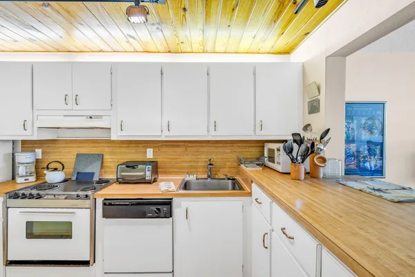 a kitchen with a stove and a cabinets
