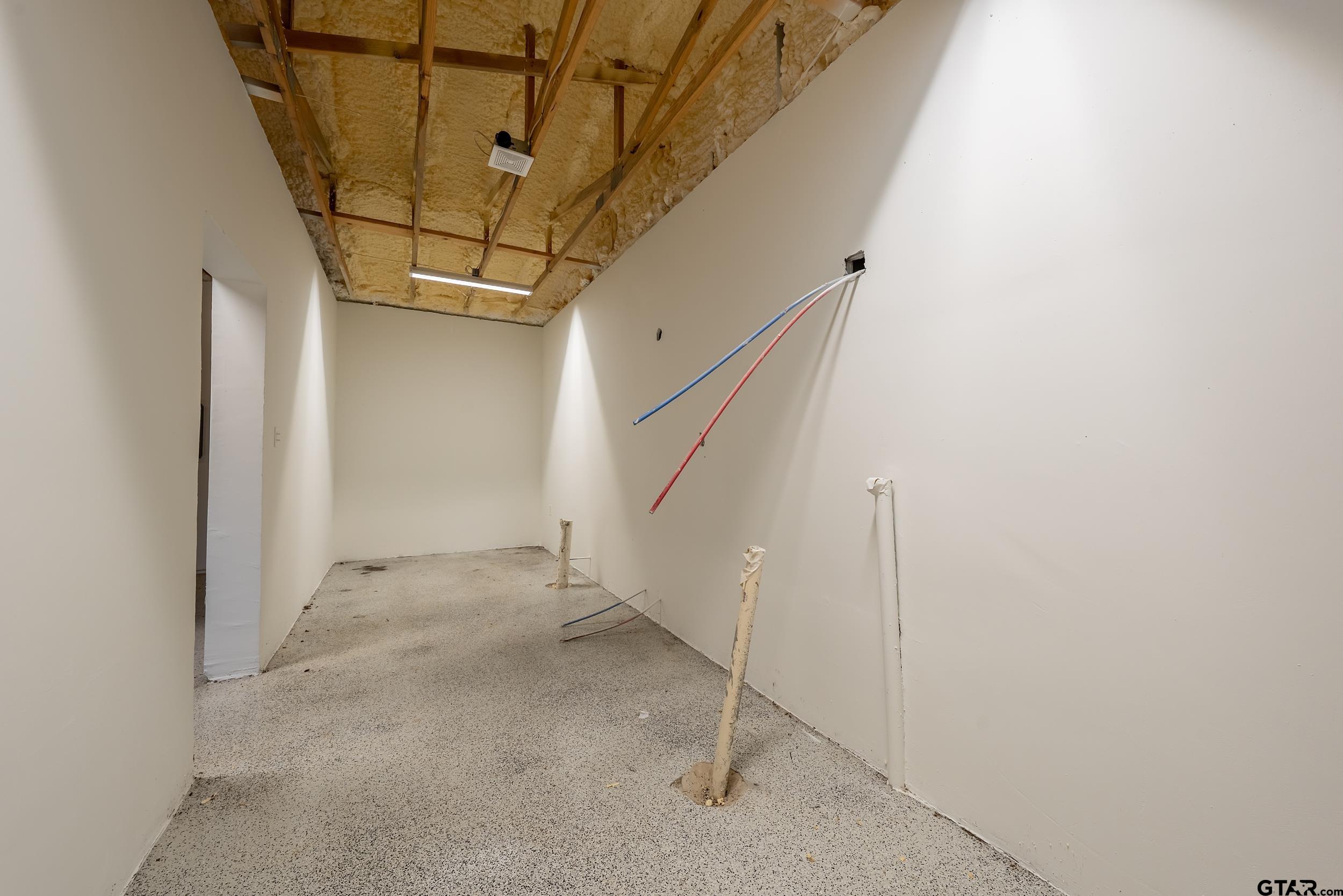 231 West Cumberland Road Tyler, TX 75703 - Photo 38 of 48 a view of a room with wooden walls