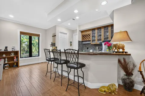 a view of a livingroom with furniture and a ceiling fan