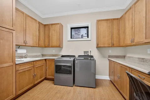 a view of a livingroom with furniture a ceiling fan and front door