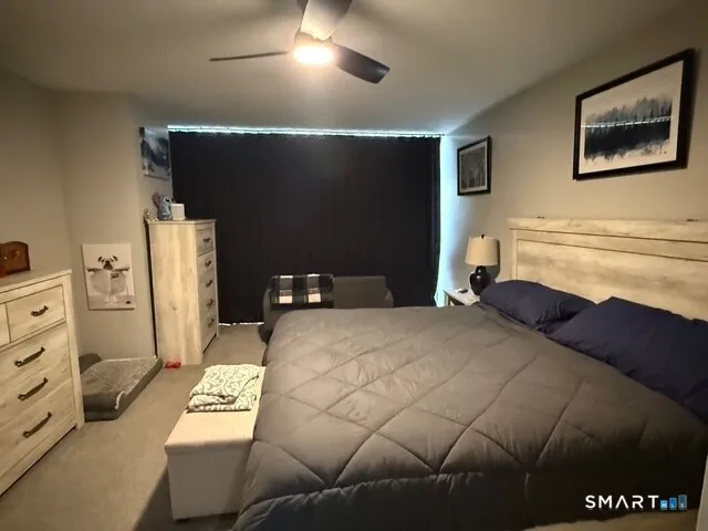 a bedroom with a bed and cabinets