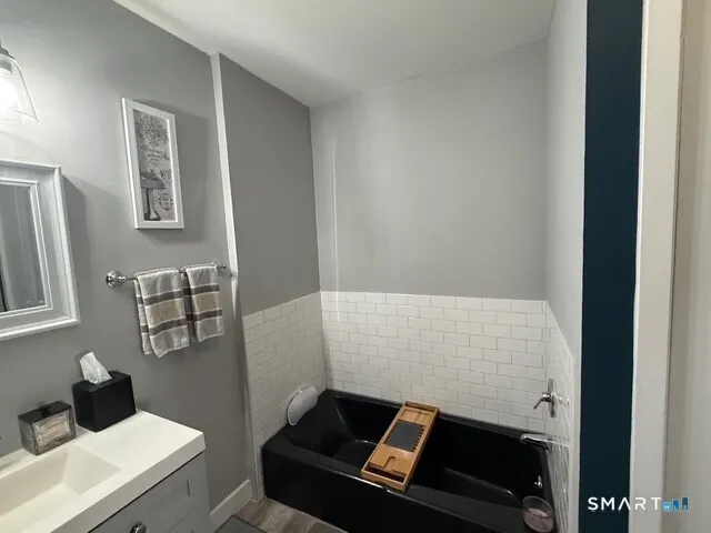 a bathroom with a shower and a tub