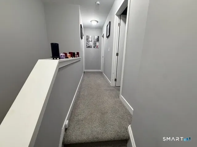 a view of a hallway with workspace