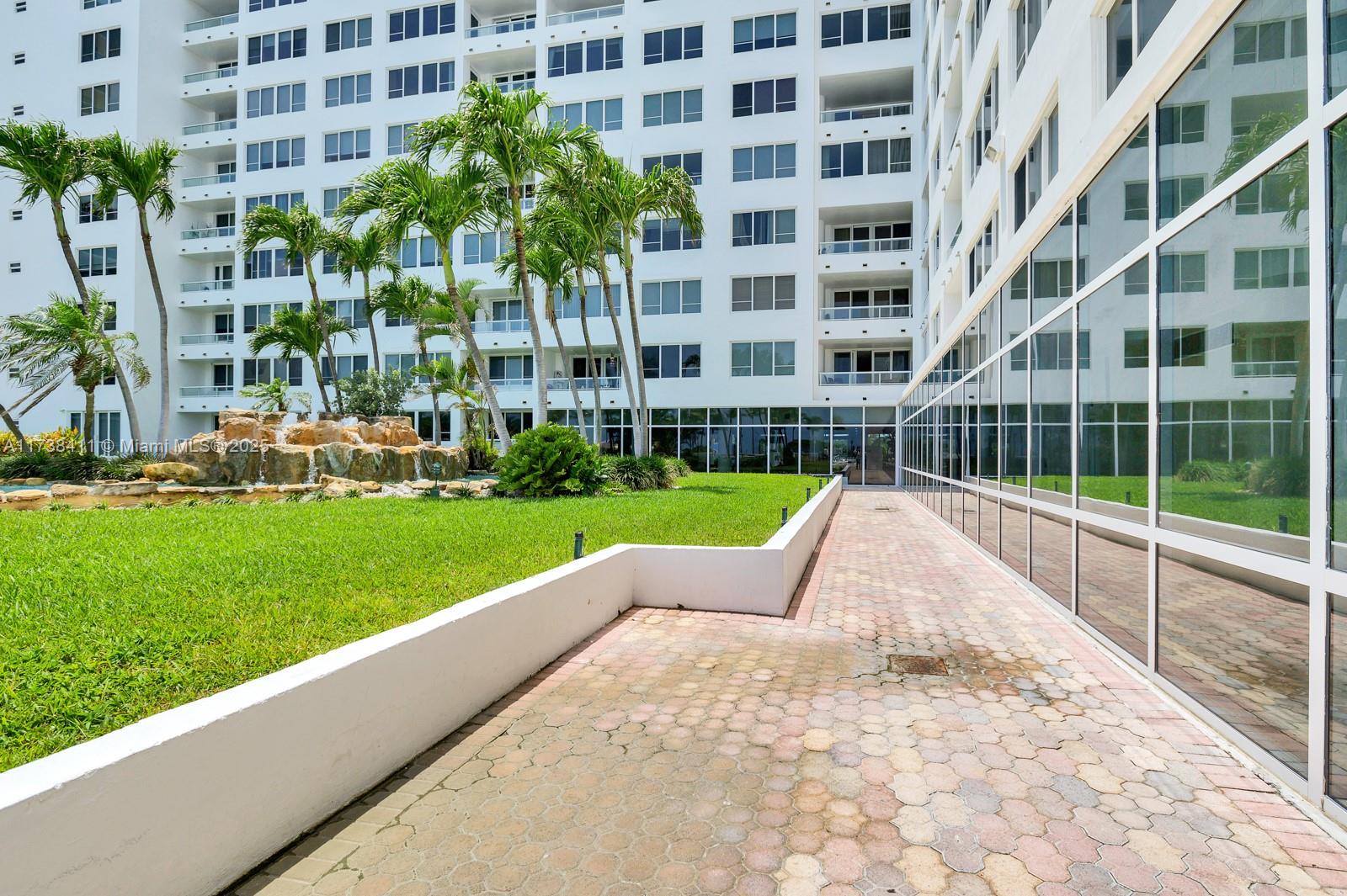 5005 Collins Avenue, Unit 724 Miami Beach, FL 33140 - Photo 14 of 15 a view of building with garden