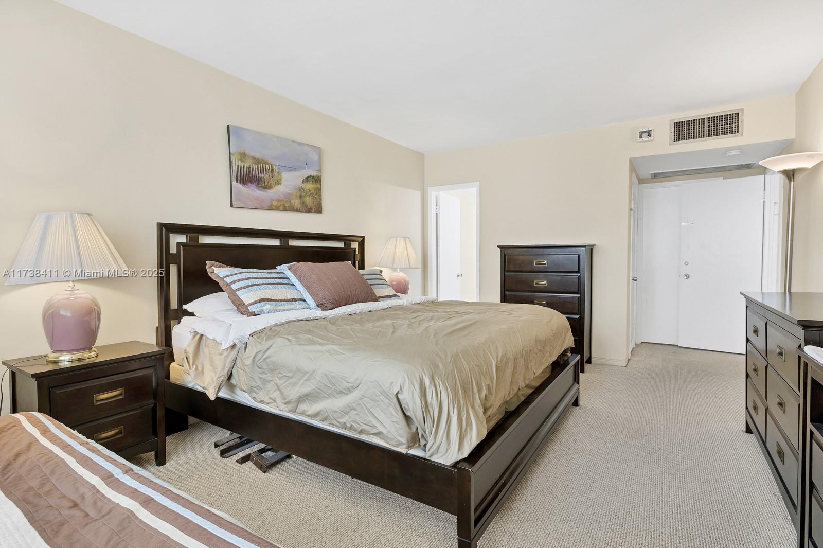 5005 Collins Avenue, Unit 724 Miami Beach, FL 33140 - Photo 9 of 15 a bed room with a bed and a television