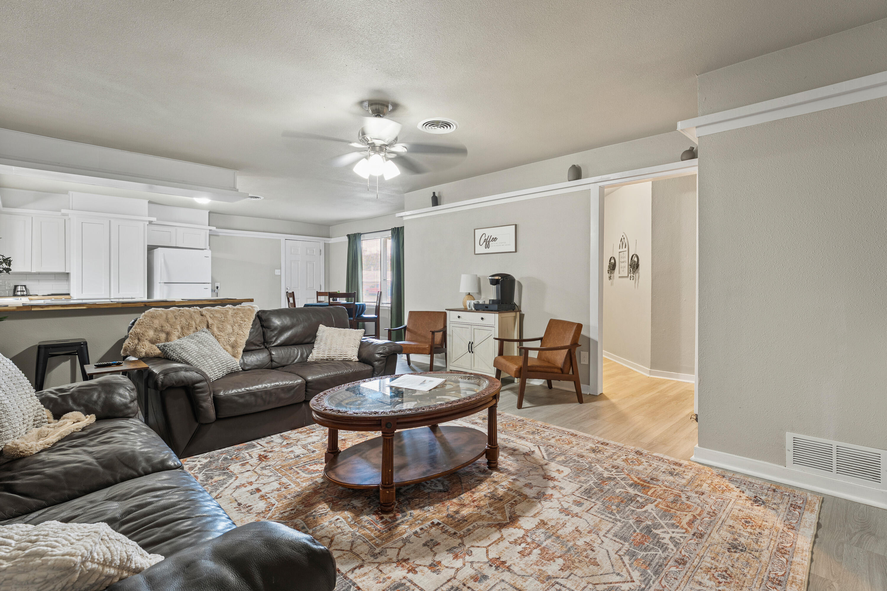5217 9th Street Lubbock, TX 79416 - Photo 3 of 18 a living room with furniture a rug and a window