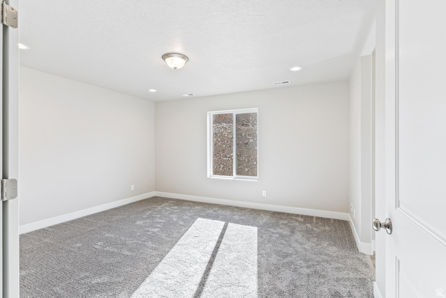 257 North Slant Road, Unit 51M Mapleton, UT 84660 - Photo 13 of 24 Unfurnished room featuring light carpet and recessed lighting