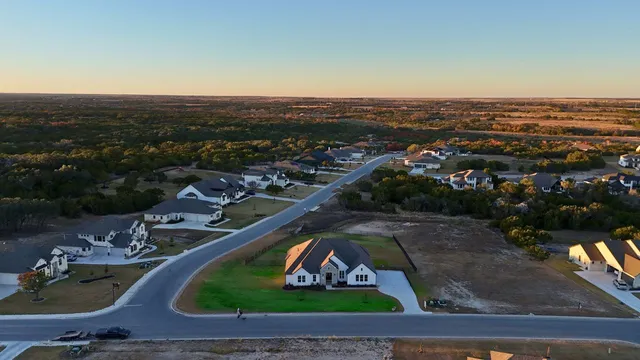 an aerial view of a house with outdoor space