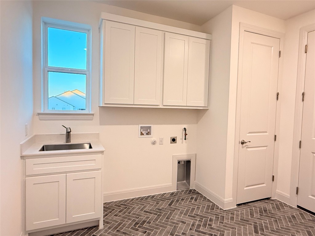 204 Rusty Colt Liberty Hill, TX 78642 - Photo 15 of 20 a kitchen with white cabinets and sink