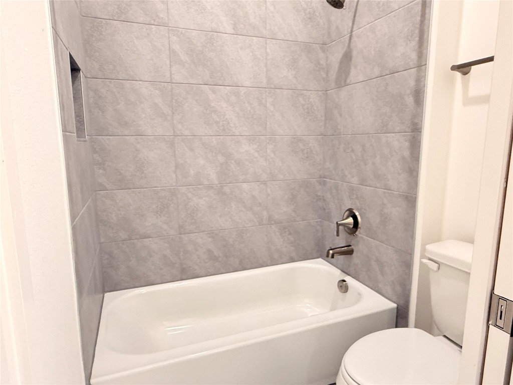 204 Rusty Colt Liberty Hill, TX 78642 - Photo 19 of 20 a white bath tub sitting next to a white toilet