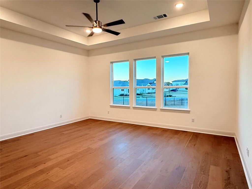 204 Rusty Colt Liberty Hill, TX 78642 - Photo 10 of 20 wooden floor in an empty room with a window