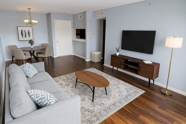 a living room with furniture and a flat screen tv