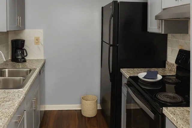 a kitchen with a sink and a stove
