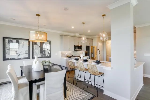 a kitchen with a refrigerator a sink and a stove