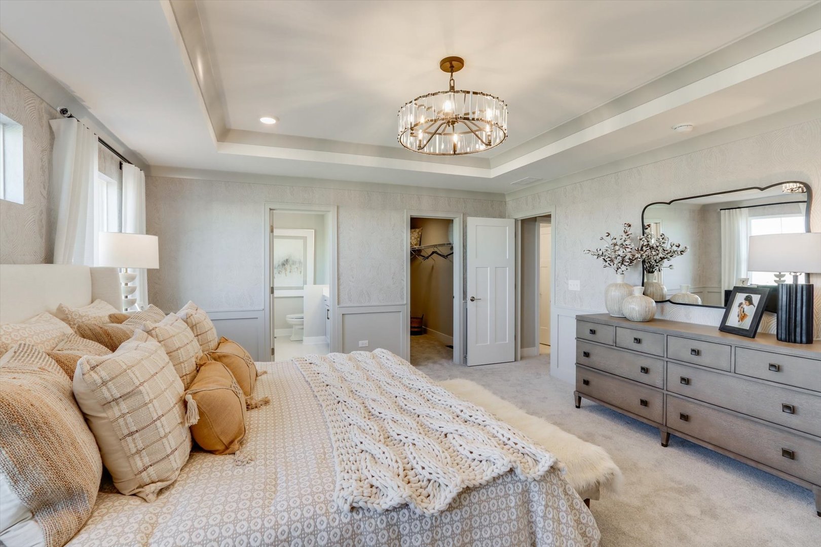 25452 West Emory Lane Plainfield, IL 60544 - Photo 23 of 31 a bedroom with a bed and a chandelier