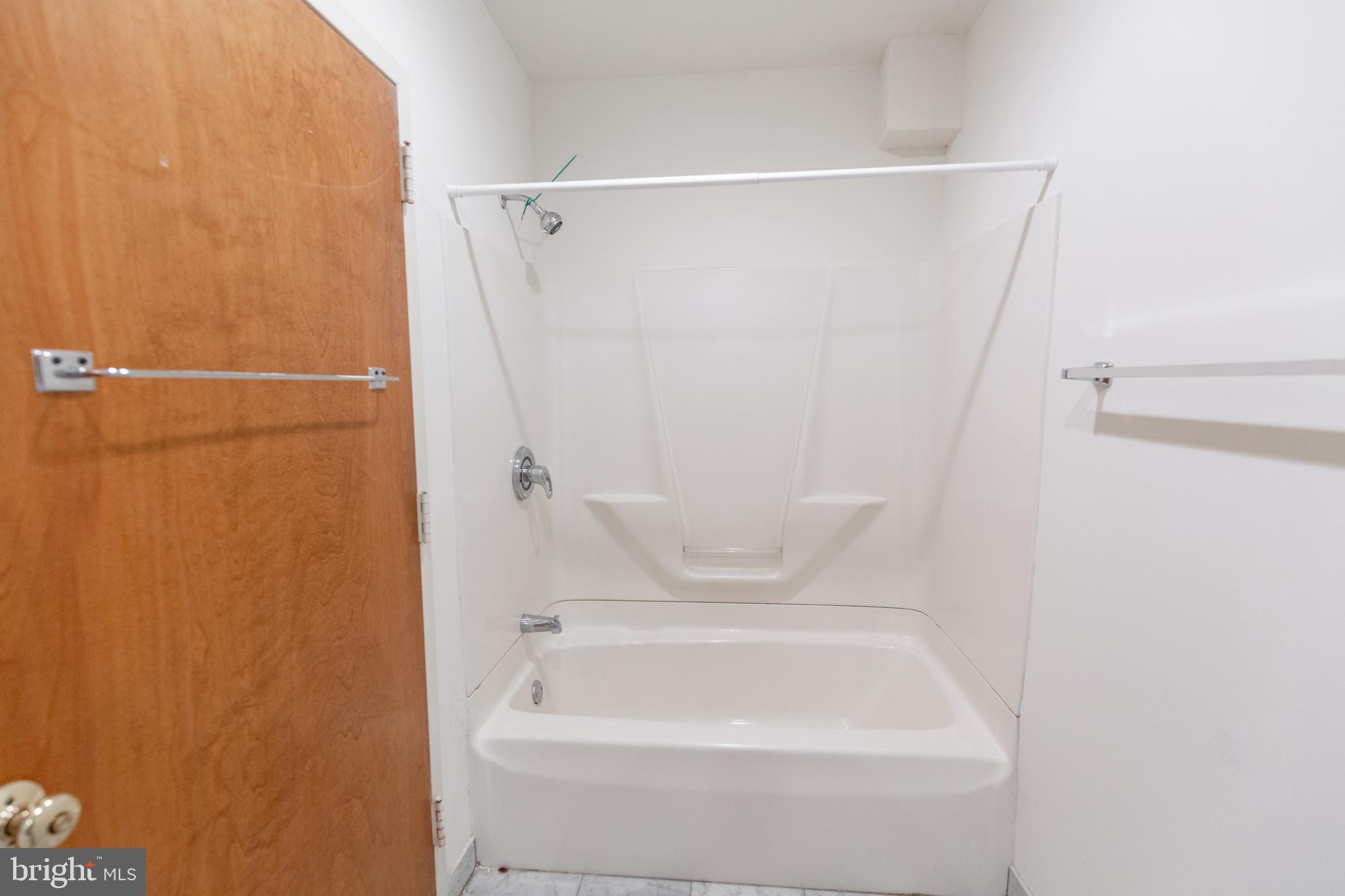 1411-5 Walnut Street, Unit 1002 Philadelphia, PA 19102 - Photo 19 of 20 a bathroom with a shower