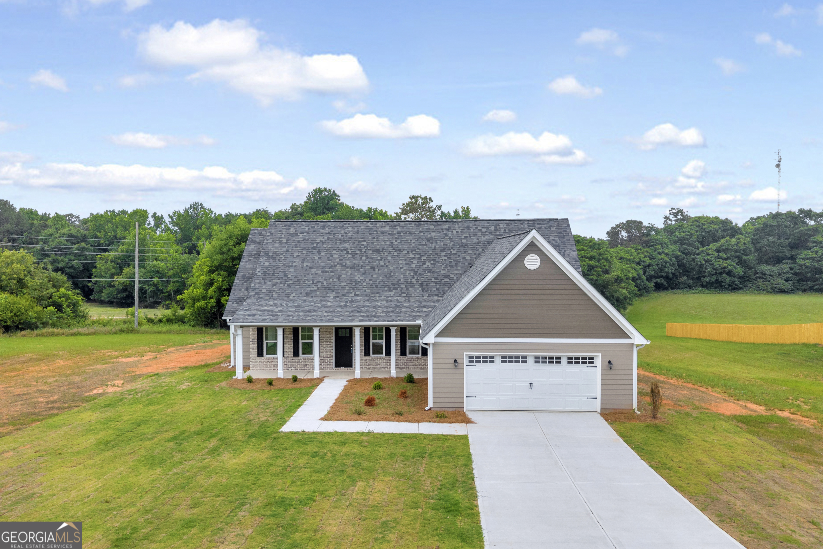 110 Sewell Road Lavonia, GA 30553 - Photo 7 of 73 a aerial view of a house next to a big yard with plants and large trees