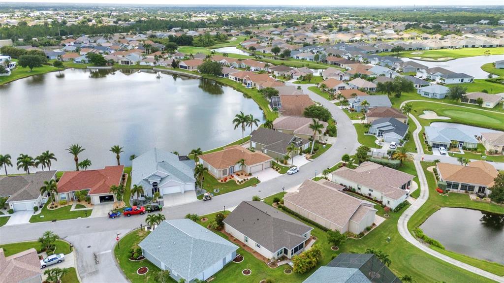 24419 Buckingham Way Punta Gorda, FL 33980 - Photo 20 of 40 an aerial view of residential houses with outdoor space and lake view