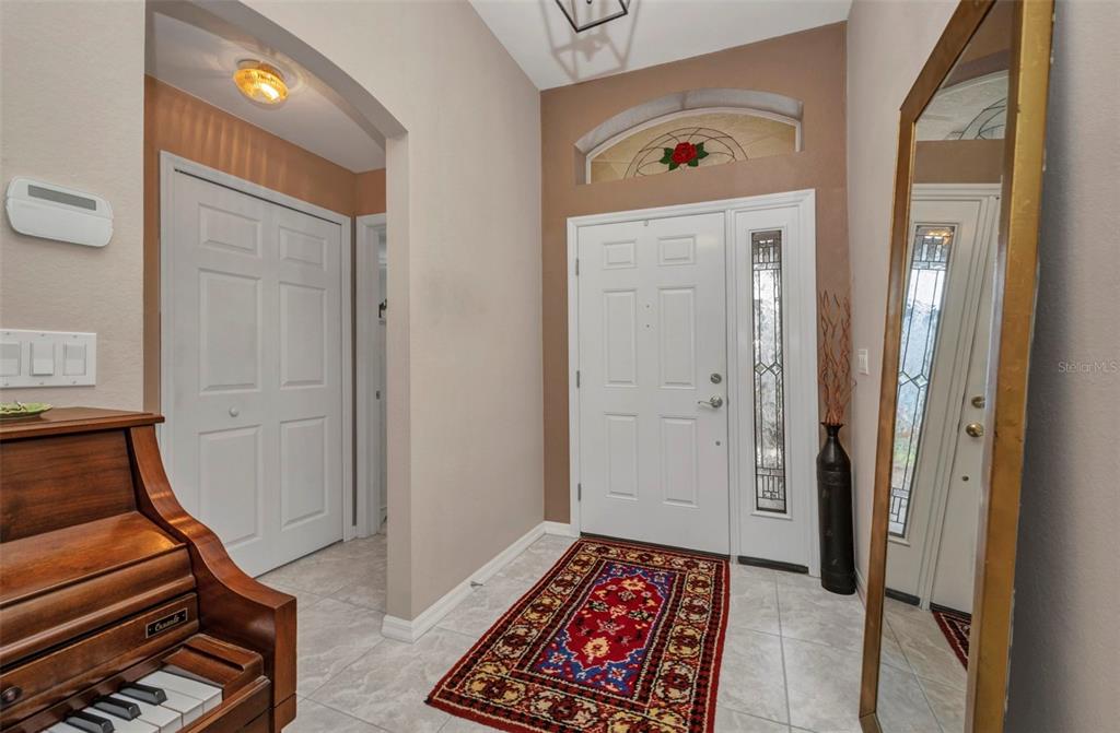 24419 Buckingham Way Punta Gorda, FL 33980 - Photo 3 of 40 a room with painting and a table