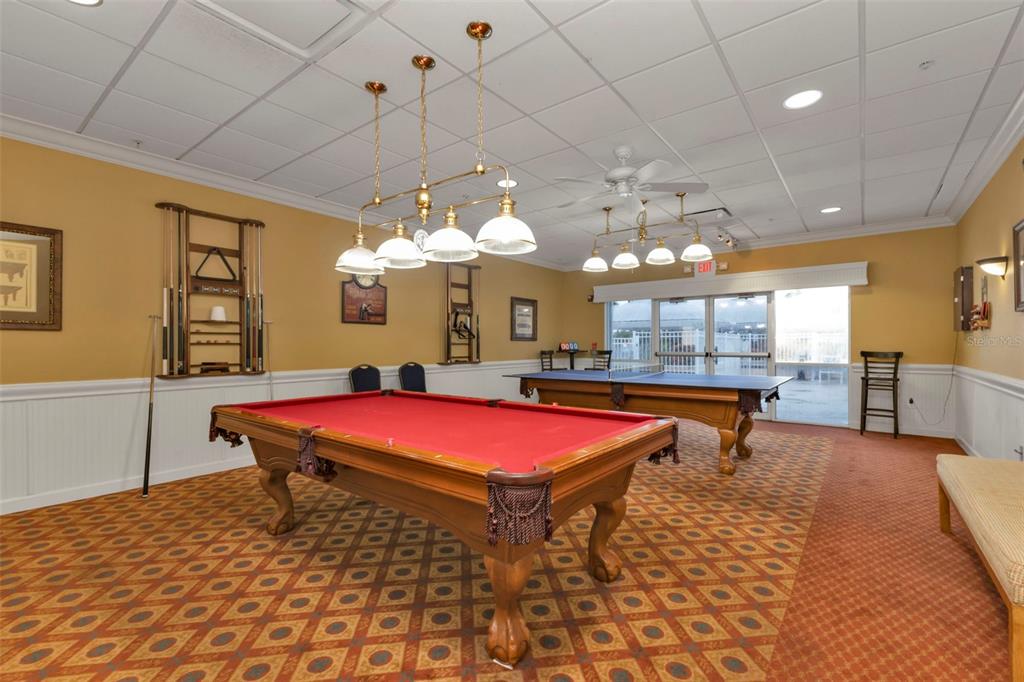 24419 Buckingham Way Punta Gorda, FL 33980 - Photo 39 of 40 a room with pool table and chandelier