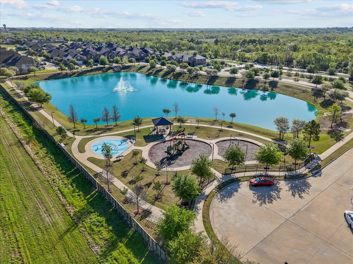 an aerial view of a house with a lake view