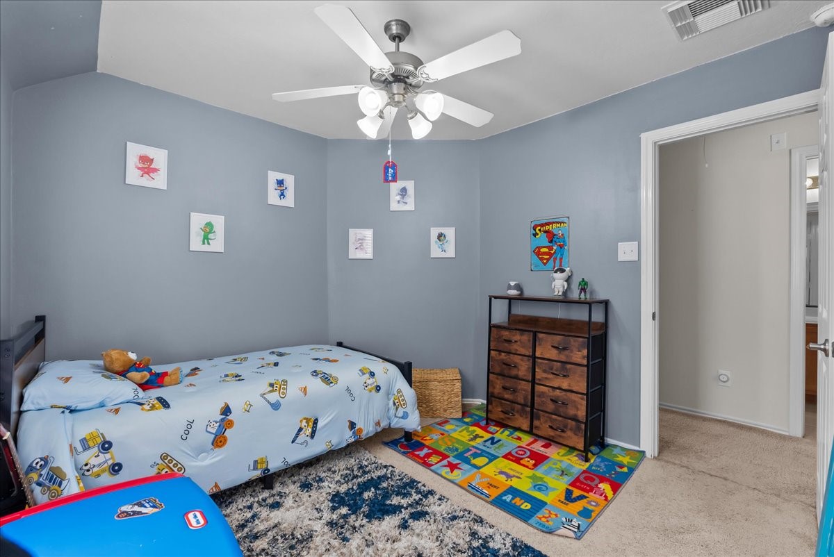 11931 Keystone Spring Way Houston, TX 77089 - Photo 19 of 34 a bedroom with a bed and a dresser in it