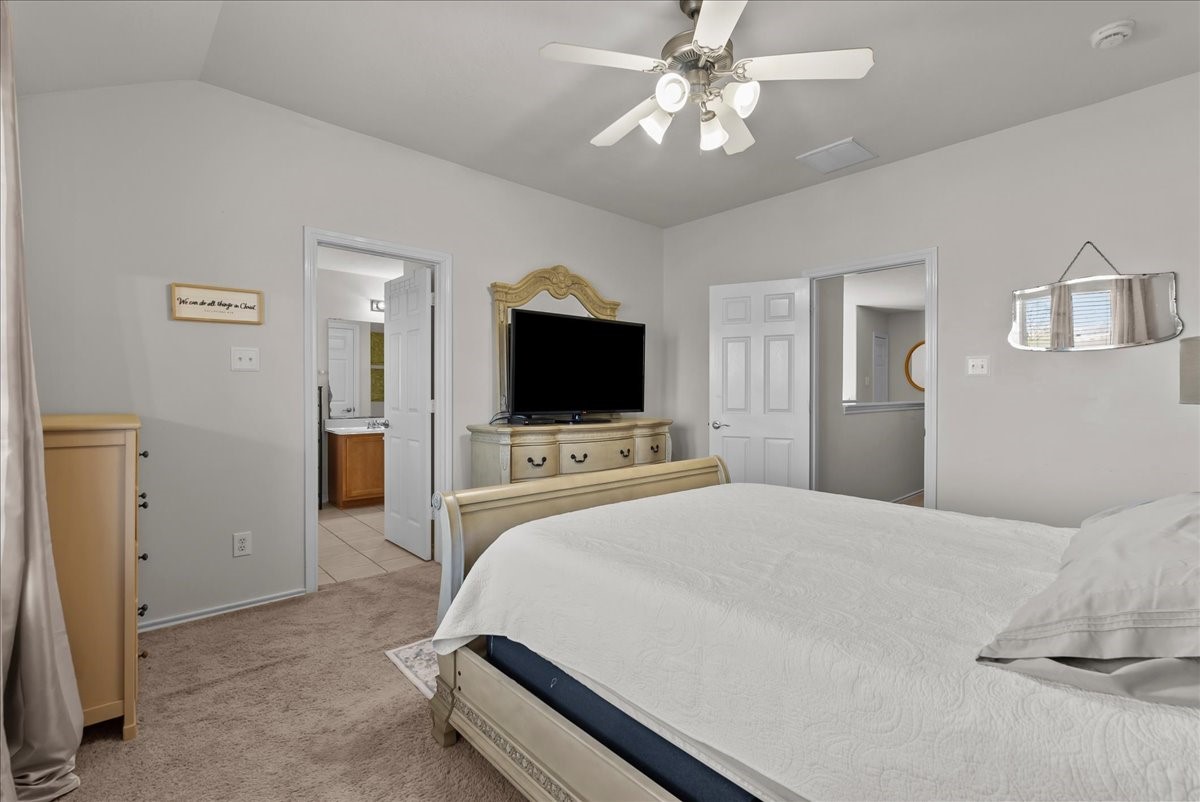 11931 Keystone Spring Way Houston, TX 77089 - Photo 24 of 34 a bedroom with a bed and a flat screen tv
