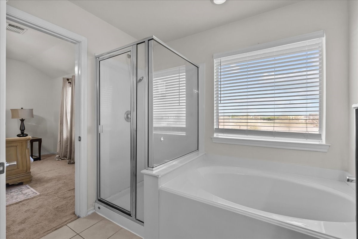 11931 Keystone Spring Way Houston, TX 77089 - Photo 27 of 34 a bathroom with a bathtub and a shower