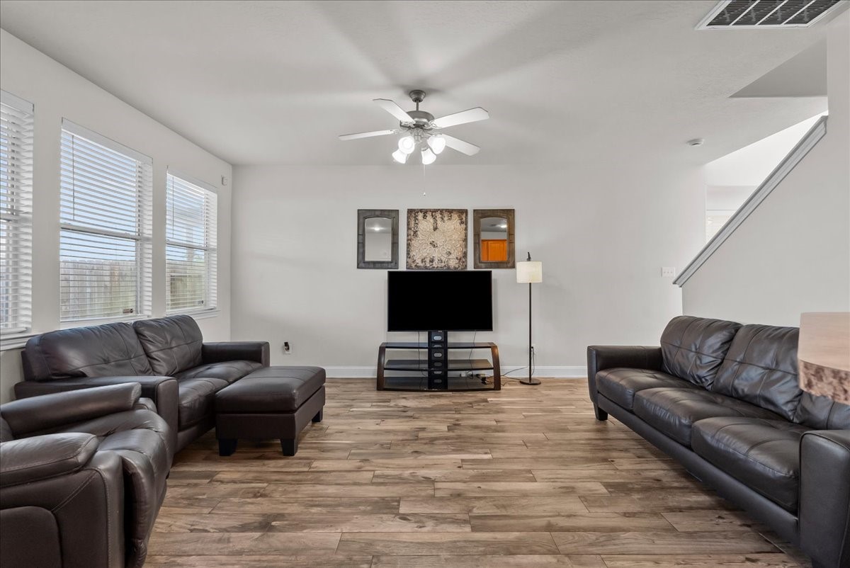 11931 Keystone Spring Way Houston, TX 77089 - Photo 8 of 34 a living room with furniture and a flat screen tv