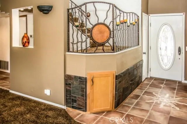 a bathroom with a granite countertop sink a mirror and vanity