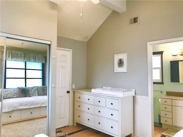 a room with a dresser and a mirror