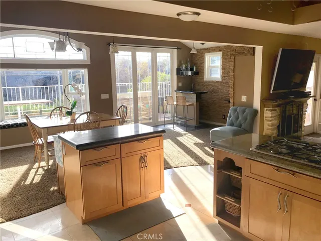 a kitchen with granite countertop a stove and a sink