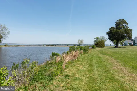 a view of a lake with a building in the background