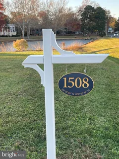 a view of outdoor space with swimming pool and trees in the background
